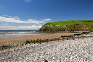Beach and grassy headland at St. Bees in Cumbria, England.