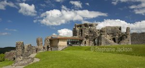 Ruins of Denbigh castle with its modern and ugly visitor centre.