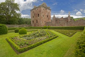 The ruins of Edzell castle, in Scotland, rise beyond a formal garden.