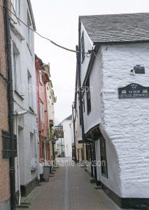 Narrow street in the Cornish coastal town of Looe in Cornwall, England.