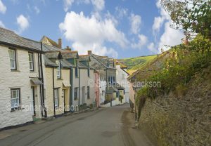 Narrow street lined with houses / cottages in the village of Port Isaac in Cornwall, England.