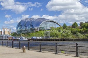 Unusual unique modern architecture, glass building, The Sage Gateshead entertainment centre beside the River Tyne at the British city of Newcastle / Newcastle-upon-Tyne in Northumberland, England.
