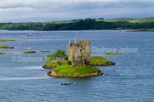 The remains of Stalker castle, a tower house / keep, are on a tiny island in Loch Laich near Port Appin, in Argyll, Scotland