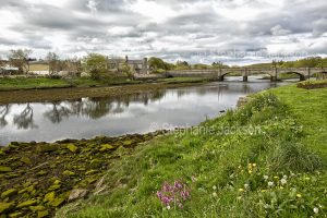 The Thurso River and arched bridge at the town of Thurso in Scotland.