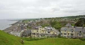 A view of the beach and the coastal town of Criccieth from the hilltop ruins of the castle that overlooks the town in Wales.