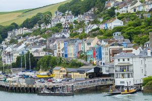 Colourful buildings and houses at the town of Dartmouth beside the wharf and the estuary of the River Dart, in Devon, England.