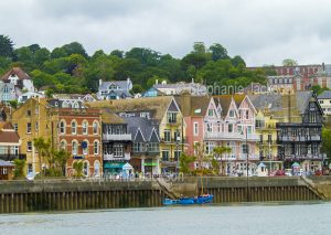 Colourful waterfront buildings and houses beside the estuary of the River Dart at the town of Dartmouth in Devon, England.
