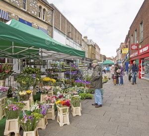 Flowers for sale at a street market in the city of Winchester in Hampshire, England.