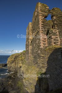 The ruins of Sinclair Girnigoe castle are perched on high cliffs at Noss Head in Scotland.