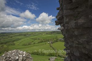 View of rural landscape and farm fields from the ruins of Carrig Cennen castle in Wales.