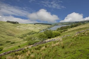 View of landscape and reservoir from Cwm Tawe Pass in Wales.