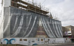 Decorative mural on building construction site in the city of Inverness in Scotland.