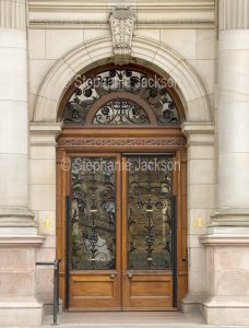 The ornate door / entrance to the historic city chambers / town hall, in the city of Glasgow, Scotland.