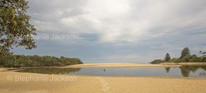 Coastal landscape with Lake Cathie separated from the Pacific Ocean by sandy beaches in NSW Australia