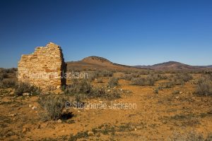 Ruins of stone building at Simonston on stony plains with rocky outcrops in the Flinders Rangers region north of Quorn in outback South Australia,